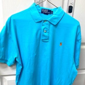 Polo short sleeve shirt medium blue with orange logo